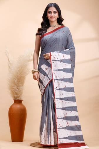 Gray malmal cotton saree with abstract white pallu and subtle red accents