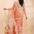 Coral dual toned muslin saree with delicate jamdani motifs and graceful contrast border