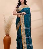 Dark teal green handloom cotton saree with mustard yellow heritage border