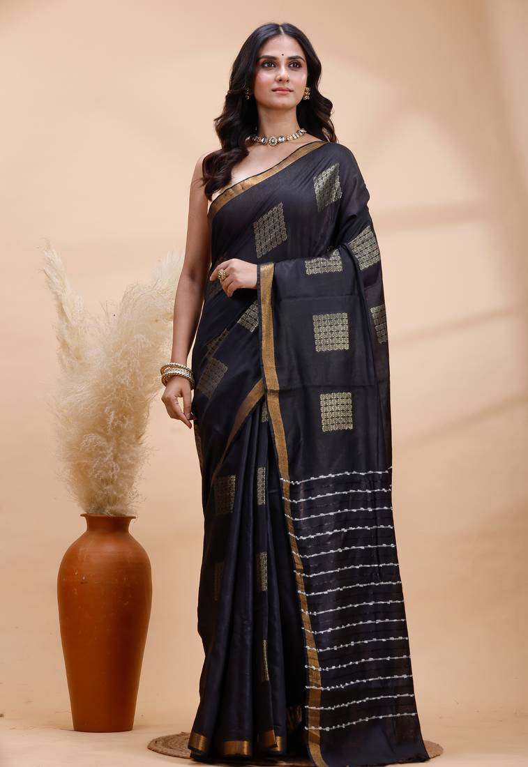 Black soft silk saree with gold zari motifs and border