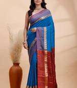Royal blue kanjivaram silk saree with purple border & red zari pallu