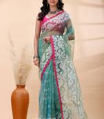 Sea green dual toned muslin saree with delicate jamdani motifs and graceful contrast border