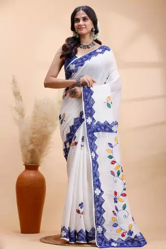 White & blue handloom saree with intricate applique work and floral artistic border