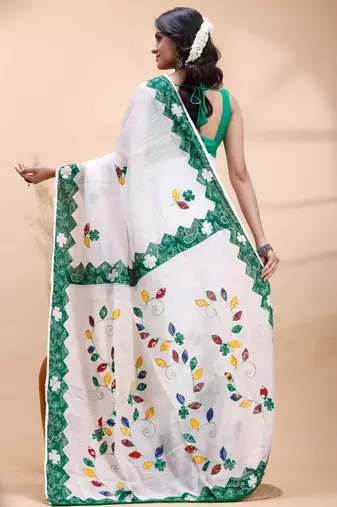 White & green  handloom saree with intricate applique work and floral artistic border