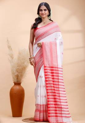 White handloom cotton saree with red traditional border & intricate weaving design 1