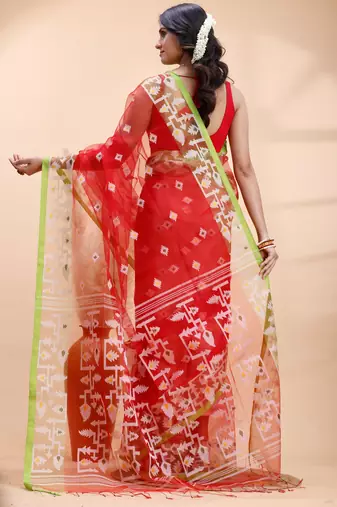 Red muslin saree with delicate jamdani motifs and green contrast border