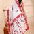 White & red handloom saree with intricate applique work and floral artistic border