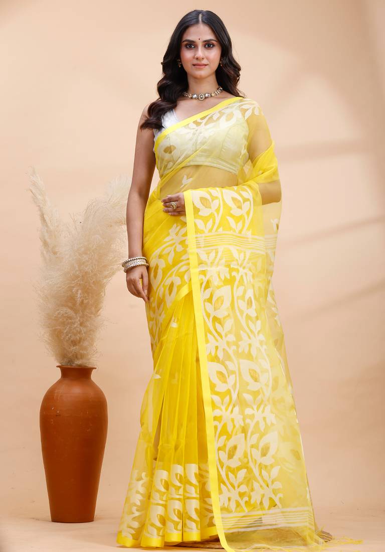 Yellow and white muslin saree with delicate jamdani motifs and self border