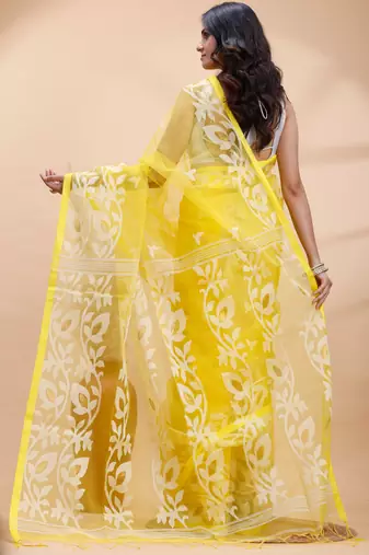 Yellow and white muslin saree with delicate jamdani motifs and self border