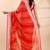 Red chiffon saree with elegant striped weave and subtle silver border detailing