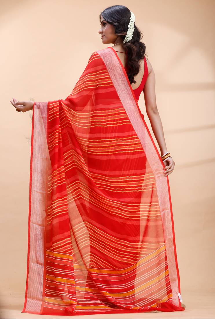 Red chiffon saree with elegant striped weave and subtle silver border detailing