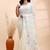 Ivory handloom cotton saree with delicate blue and golden floral buti and artistic woven pallu