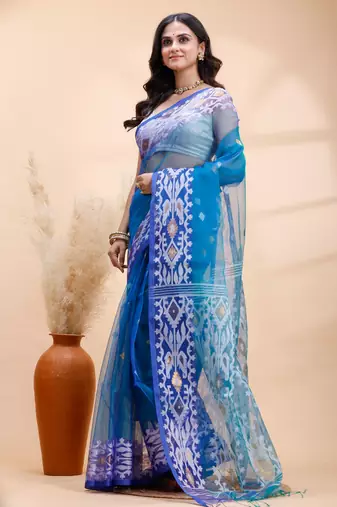Blue dual toned muslin saree with delicate jamdani motifs and graceful contrast border