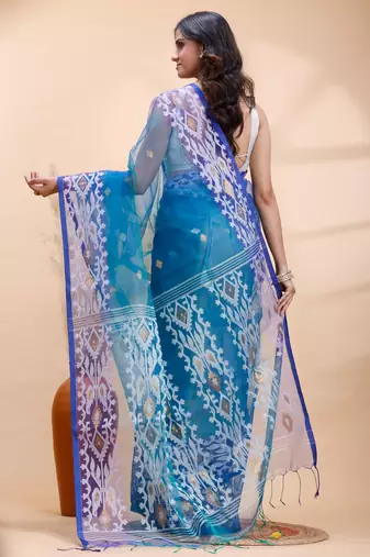 Blue dual toned muslin saree with delicate jamdani motifs and graceful contrast border
