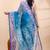 Blue dual toned muslin saree with delicate jamdani motifs and graceful contrast border