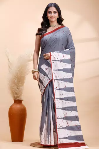 Gray malmal cotton saree with abstract white pallu and subtle red accents