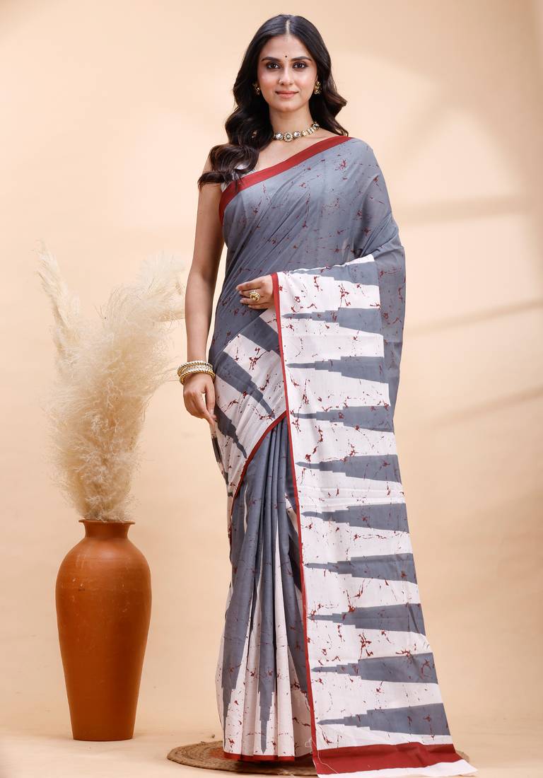 Gray malmal cotton saree with abstract white pallu and subtle red accents
