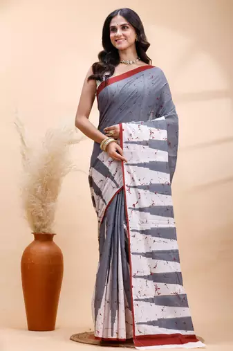 Gray malmal cotton saree with abstract white pallu and subtle red accents
