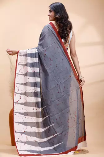 Gray malmal cotton saree with abstract white pallu and subtle red accents