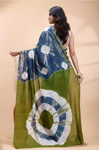 Indigo and olive bagru malmal cotton saree with artistic tie-dye circles & vibrant handcrafted patterns