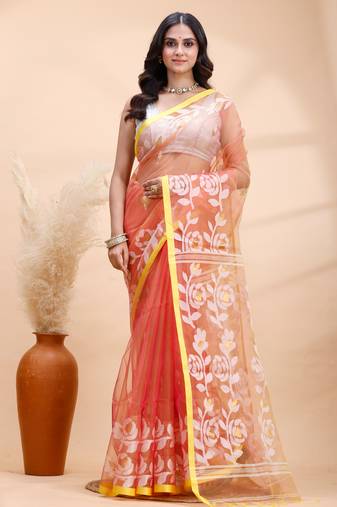 Coral dual toned muslin saree with delicate jamdani motifs and graceful contrast border