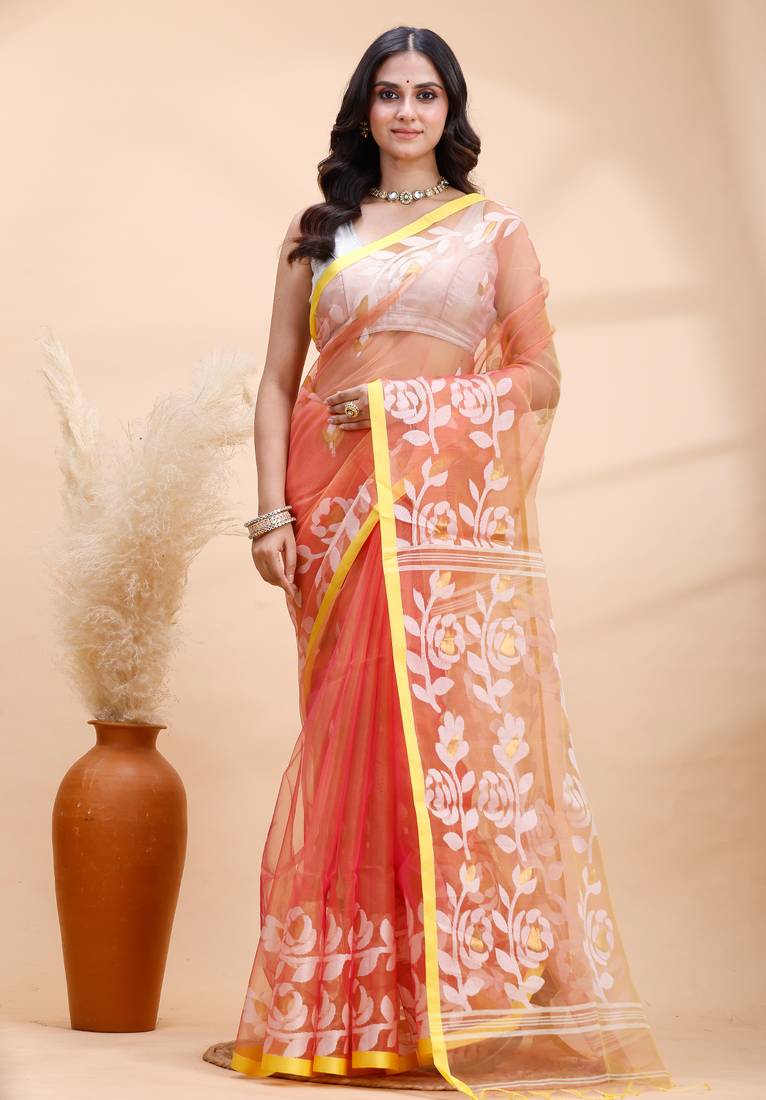 Coral dual toned muslin saree with delicate jamdani motifs and graceful contrast border