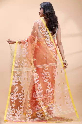 Coral dual toned muslin saree with delicate jamdani motifs and graceful contrast border