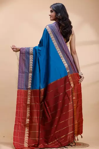 Royal blue kanjivaram silk blend saree with purple border & red zari pallu