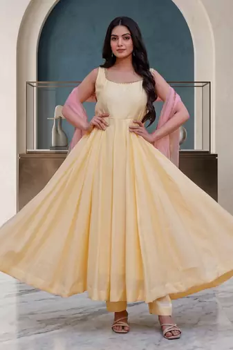 Elegant pastel yellow anarkali dress with soft pink dupatta