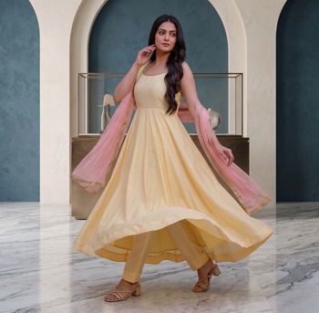 Elegant pastel yellow anarkali dress with soft pink dupatta 2