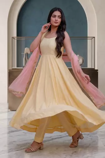 Elegant pastel yellow anarkali dress with soft pink dupatta