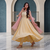 Elegant pastel yellow anarkali dress with soft pink dupatta