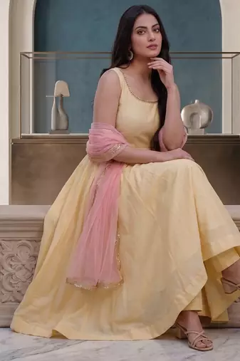 Elegant pastel yellow anarkali dress with soft pink dupatta