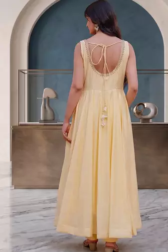 Elegant pastel yellow anarkali dress with soft pink dupatta