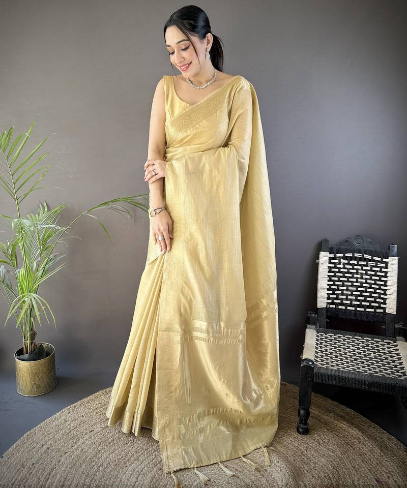 Beige striped, zari woven cotton saree with blouse