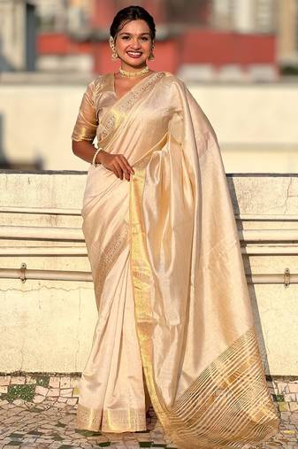 Cream striped, solid,  zari woven tussar silk saree with blouse