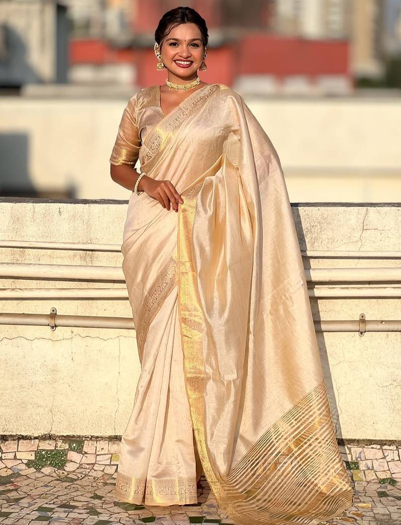 Cream striped, solid,  zari woven tussar silk saree with blouse