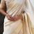 Cream striped, solid,  zari woven tussar silk saree with blouse
