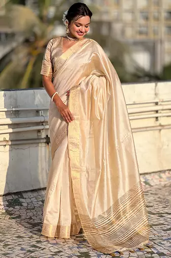 Cream striped, solid,  zari woven tussar silk saree with blouse