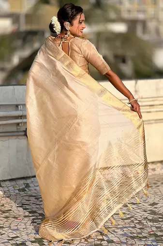 Cream striped, solid,  zari woven tussar silk saree with blouse