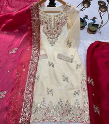 Cream kameez with rani pink palazzo embroidered suit