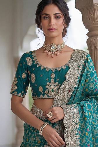 Turquoise Color Embroidered Lace,Dori,Multi Thread And Zari With Sequins And Zircon Diamond Work Banarasi Silk Saree