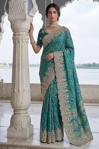 Turquoise Color Embroidered Lace,Dori,Multi Thread And Zari With Sequins And Zircon Diamond Work Banarasi Silk Saree