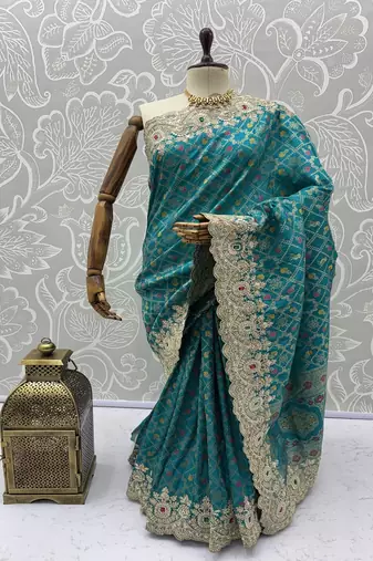 Turquoise Color Embroidered Lace,Dori,Multi Thread And Zari With Sequins And Zircon Diamond Work Banarasi Silk Saree