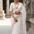 White chiffon saree with all over designer embroidery