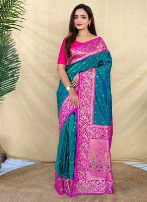 teal green soft silk saree adorned with delicate zari woven buttas 1