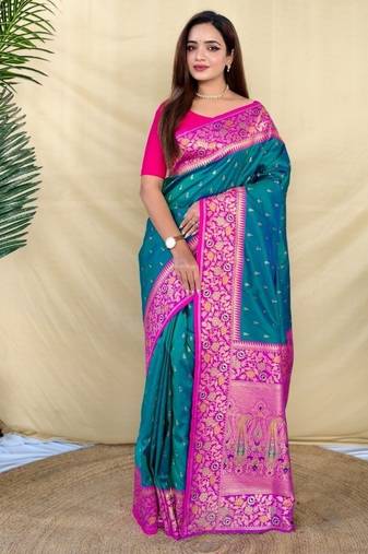 teal green soft silk saree adorned with delicate zari woven buttas