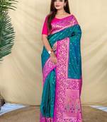 teal green soft silk saree adorned with delicate zari woven buttas