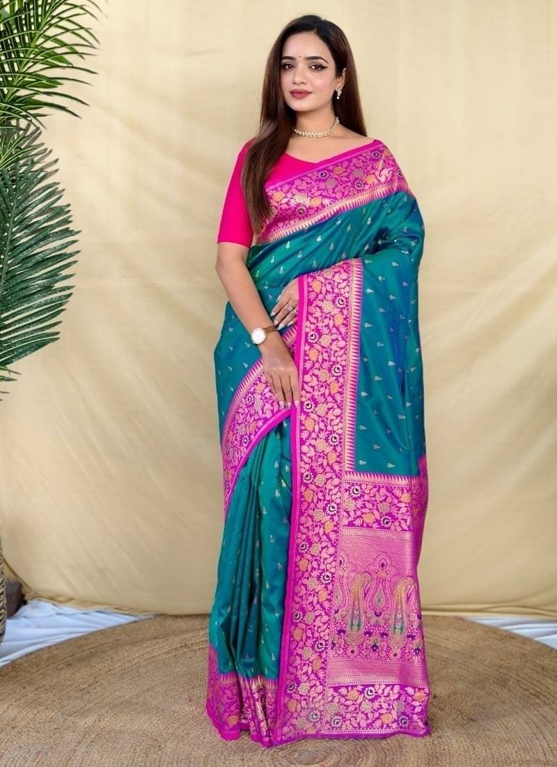 teal green soft silk saree adorned with delicate zari woven buttas