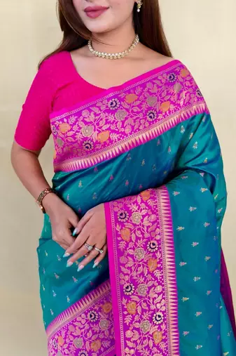 teal green soft silk saree adorned with delicate zari woven buttas